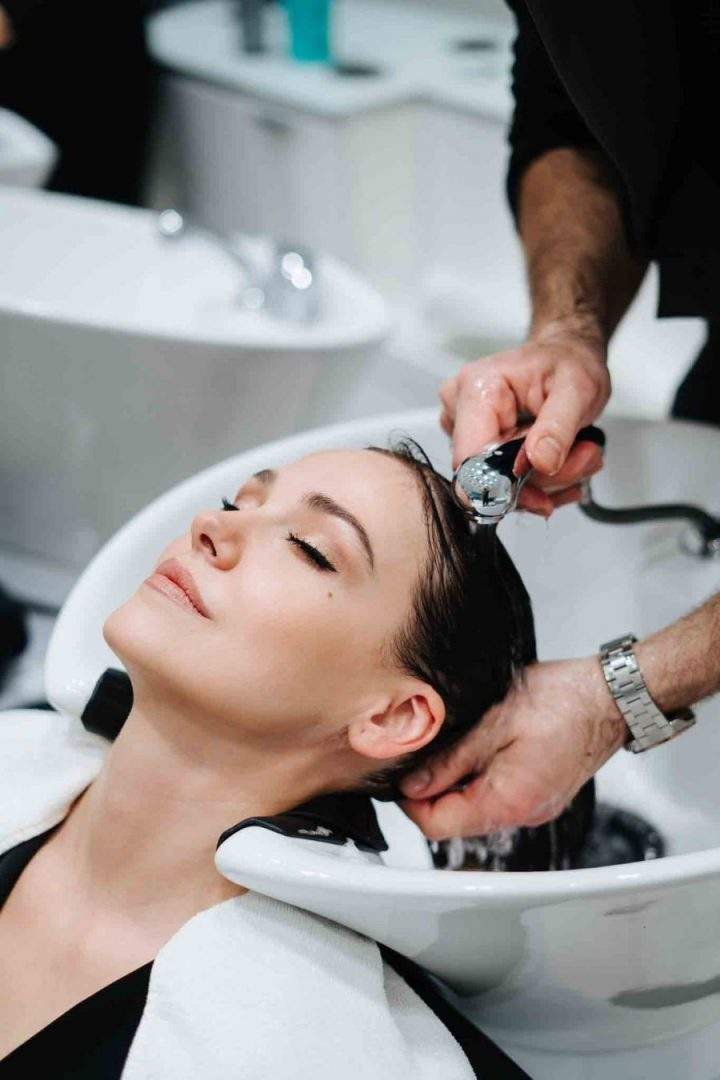 woman having her hair washed at the salon