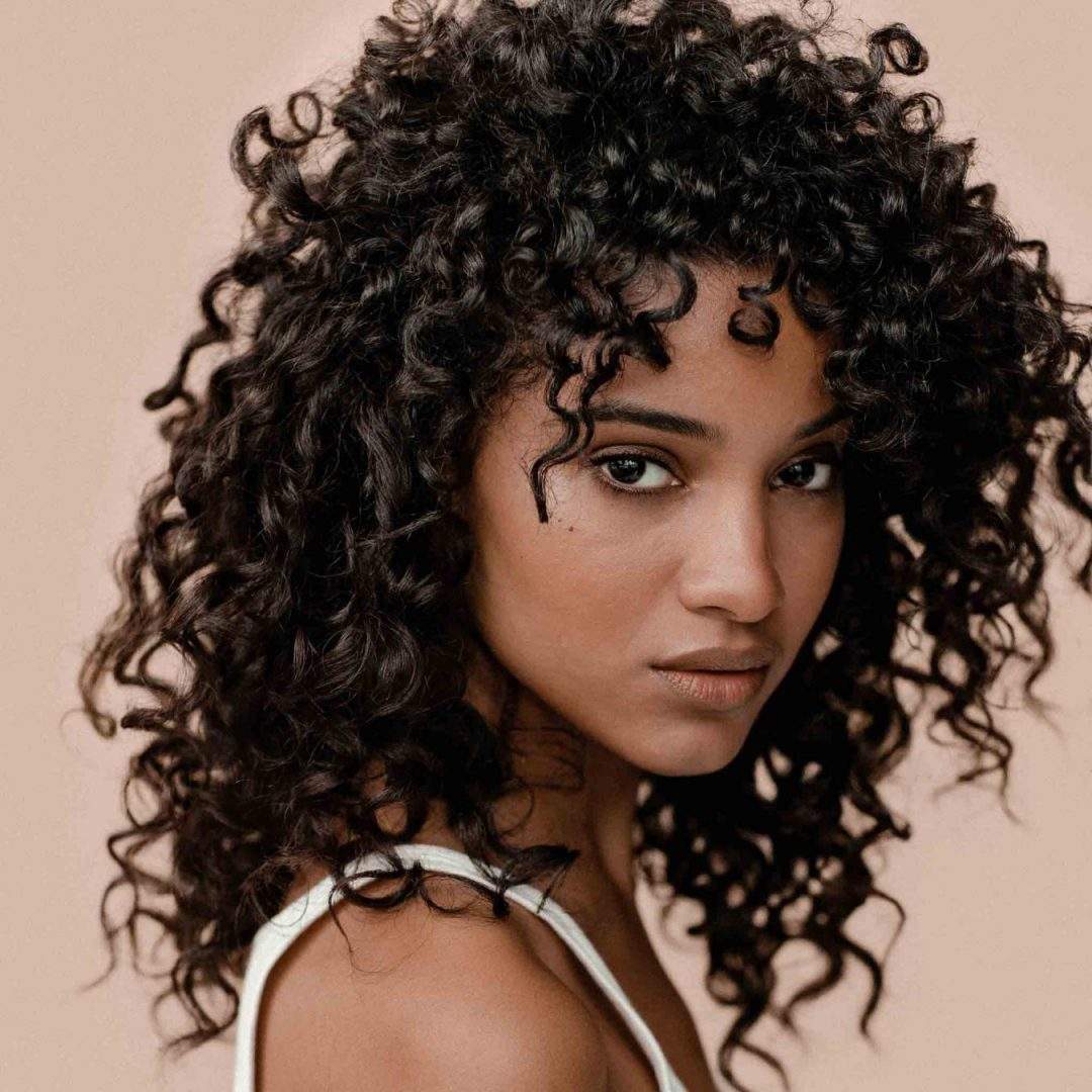 woman with dark curly hair